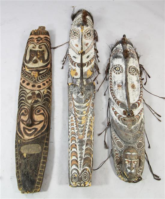 Two Sepik River similar carved and painted ancestor boards & a shield